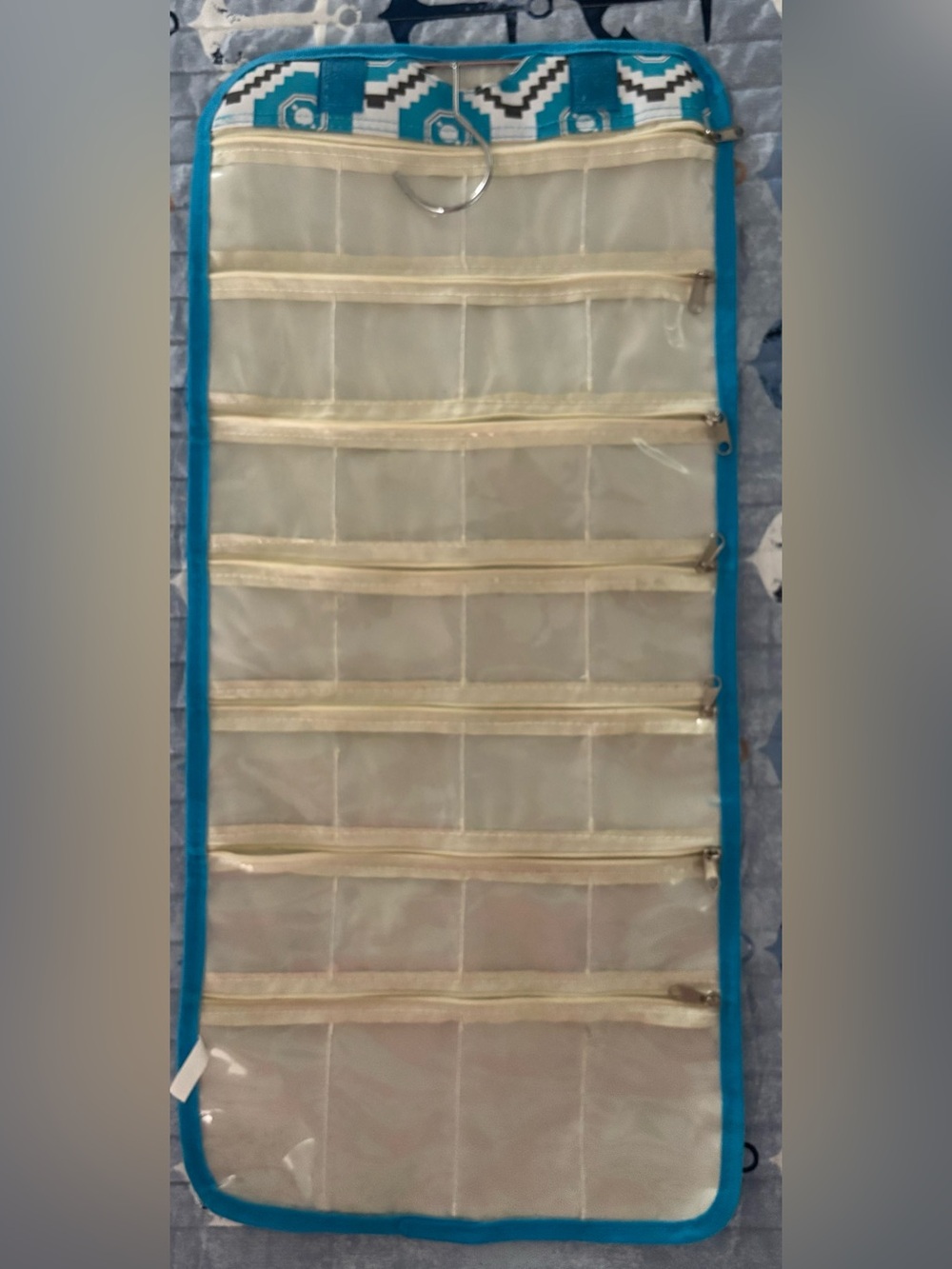 Blue Hanging Pocket Jewelry Organizer with Clear Zip Pouches
